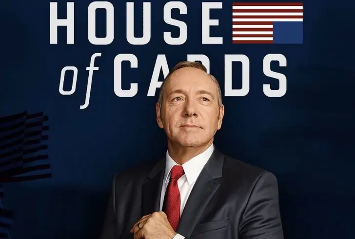 Kevin Spacey stands before House of Cards backdrop