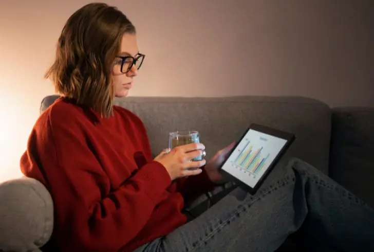 Woman watching finance graph
