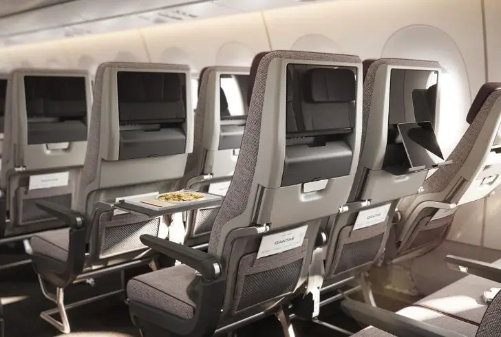Luxurious first-class suite with reclining chair and 32-inch touch-screen TV.