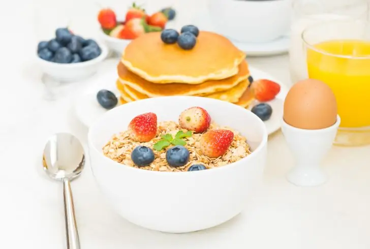 Breakfast bowl with eggs, fruit, and oats