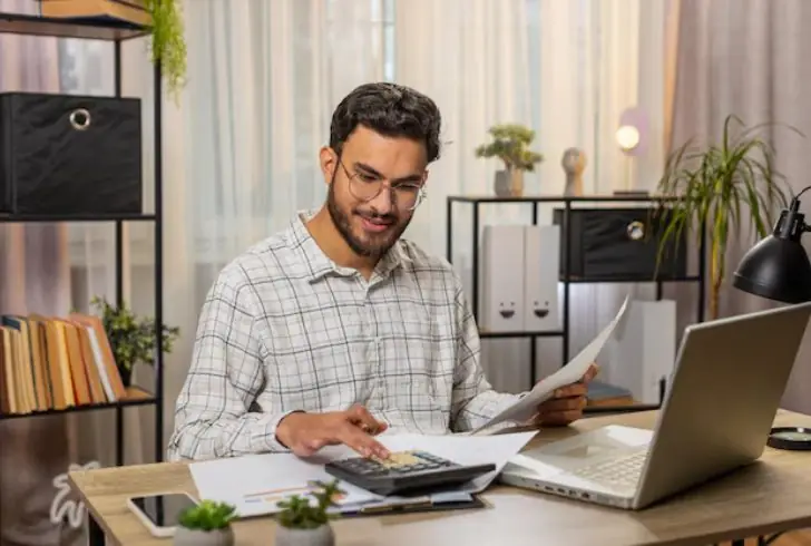 Person planning finances with gratitude